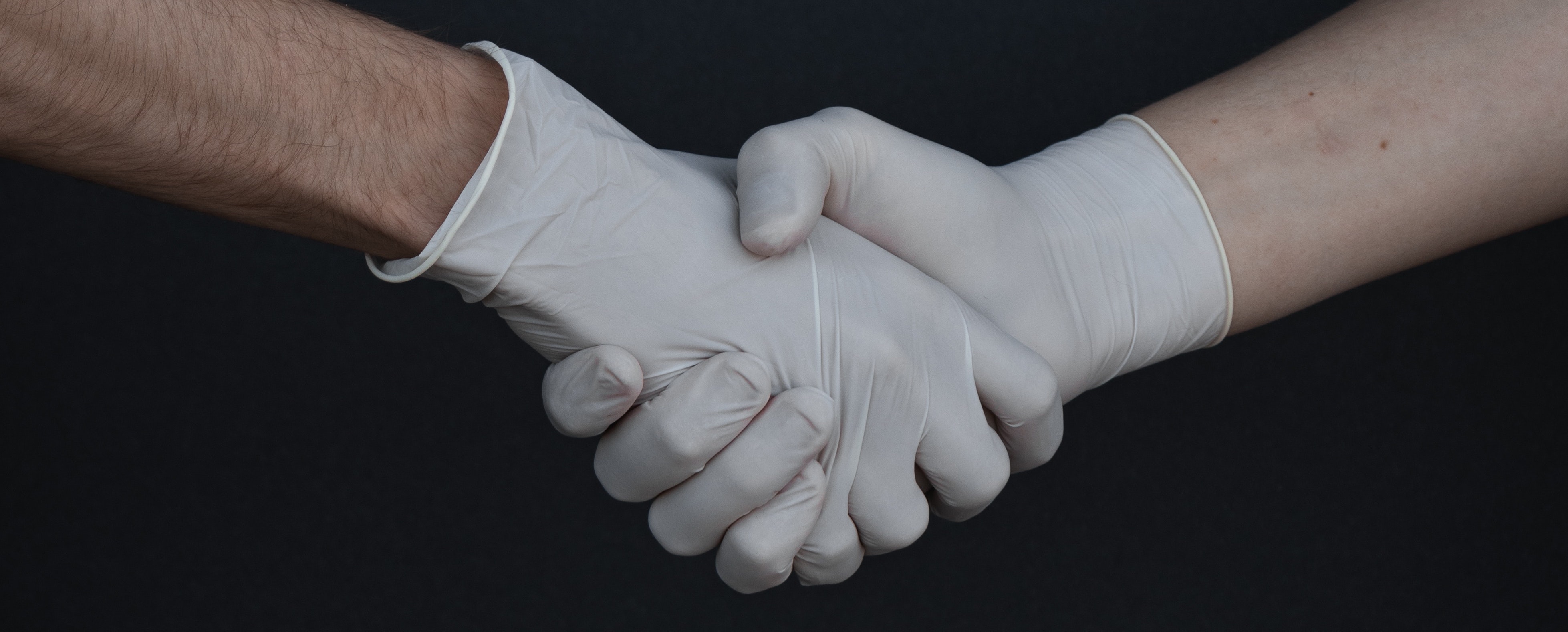 people-shaking-hands-in-latex-gloves-3959482